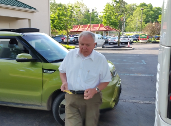 Grand Tours - Lockport, NY. The driver. Also shows how he blocked me in. He was getting out his license, I think? Why, I don't know.