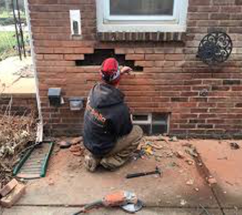 MASONRY-RESTORED. Tuck-pointing and brick replacement.