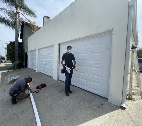 YZ Garage Doors & Gates - Repair, Installation, Replacement Services - Valley Village, CA. Sectional steel triple car garage doors installation Redondo beach, CA