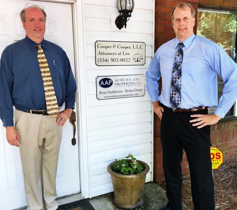 Cooper and Cooper Attorneys at law - Auburn, AL. Andrew and Larry outside the office.