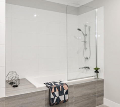 Bradnam's Windows & Doors - Mount St John, QLD. Fixed Shower Screen Above A Bath
