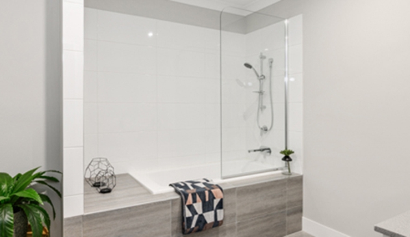 Bradnam's Windows & Doors - Warana, QLD. Fixed Shower Screen Above A Bath