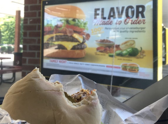 Sonic Drive-In Corporate Headquarters - Oklahoma City, OK. My albino burger... 
I sent back the first albino bun, the manager assured me these we the same buns they always used... Look at the photo!