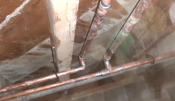 Bob Hunter Plumbing & Heating Company. New piping under the house.