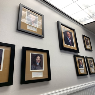 Applegate Dentistry & Medspa - Covington, KY. Staff introduction photos display on the wall at Applegate Dentistry & Medspa Covington KY