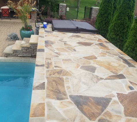 Sweet Magnolia Landscape Design - Huntsville, AL. Flagstone Tanning ledge and stone slab steps