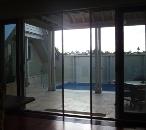 RETRACTASCREEN - Cheltenham, VIC. Dual Retractascreen On Timber Dual Stacker Door Partially Retracted