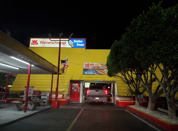 Wienerschnitzel - Yuma, AZ. Bill Lewis of Vero Beach, Florida, making a quick pitstop at Wienerschnitzel of Yuma, Arizona.