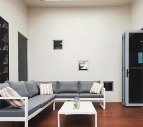 Bradnam's Windows & Doors - Kawana, QLD. Ultra Silver Aluminium Bi-Fold Door With Grey Glass