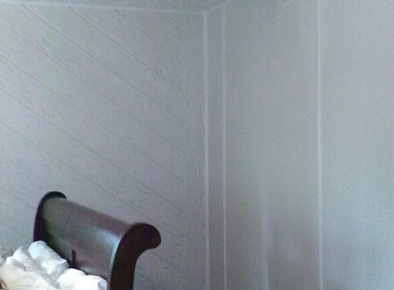 Katies Painting - Rockford, IL. After photo of raw Cedar walls caulked primed and painted