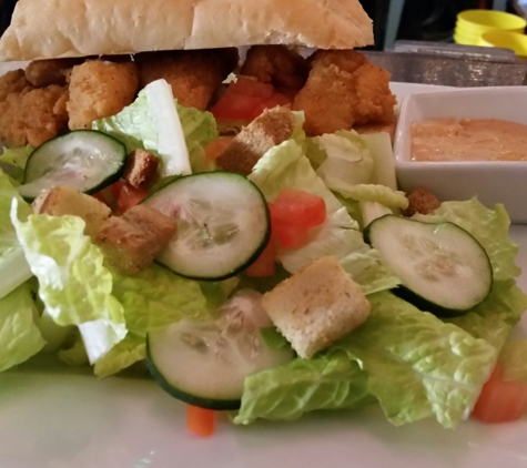 Doc Ryan's - Forest Park, IL. Po Boy grouper fish sandwich ($6) with side salad substituted for fries with a cider.  
Yummy!