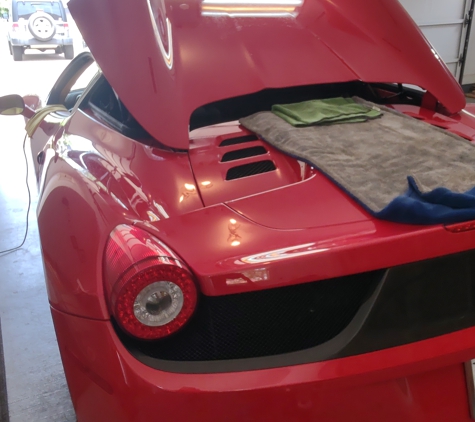 The Ding Company - Austin, TX. Ferrari Mobile Dent Repair On Tonneau Cover.