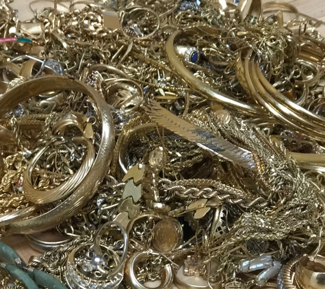 Crown Gold Exchange - Hemet, CA. pile of mixed gold jewelry 10, 14 and 18 karat.  Consists of rings, bracelets, necklaces, earrings brooches and more fine gold items.