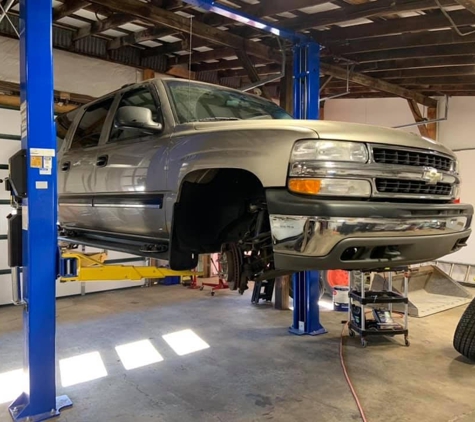 Triple H Tire & Automotive - Piney Flats, TN. Chevy Suburban getting new brake pads, rotors and shocks