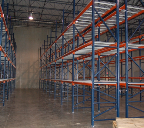 Warehouse Cubed Consulting Group - Prosper, TX. Rack Install Modular shipping office in the backgroud