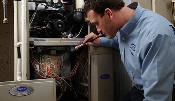 Green Home Solutions Heating and Cooling, Insulation - Cleveland, OH. A licensed certified GHS technician performs a furnace clean and tune.