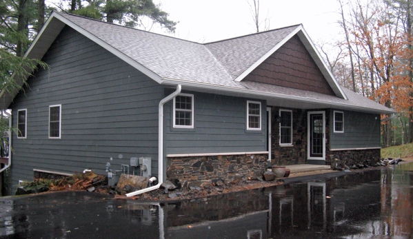 The Lakewood Companies, Inc. - Arbor Vitae, WI. Replaced exterior finishes with stone, low maintenance siding