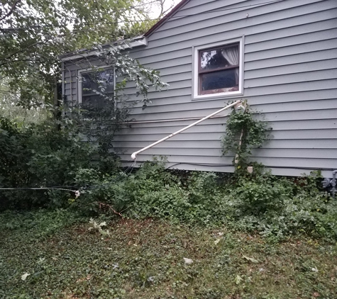 National Electric - Emporia, KS. Before, house with storm damaged area.