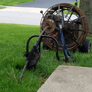 Roto-Rooter Plumbing & Water Cleanup - Fishers, IN. Giant chunk of sheared-off root hanging from the line that was just pulled up.