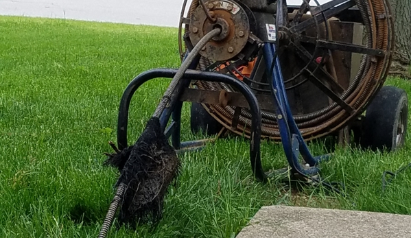 Roto-Rooter Plumbing & Water Cleanup - Fishers, IN. Giant chunk of sheared-off root hanging from the line that was just pulled up.