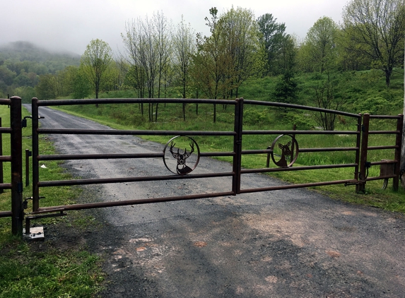 Tri State Gate - Bedford Hills, NY. Custom metal deer head design driveway gate by Tri State Gate, Bedford Hills, New York