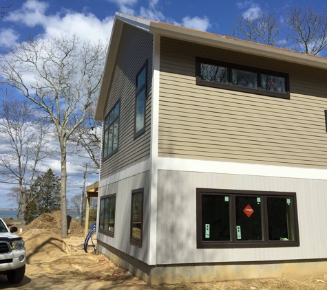 Taylor Forest Products Incorporated - Pembroke, MA. Allura Fibercement Siding on 2nd Floor, Primed Vertical CVG Red Cedar Siding on 1st Floor and  PVC Trimboards by Taylor Forest Products MA