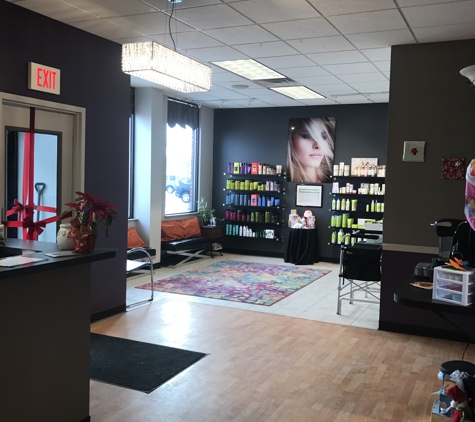 Total Knockout Salon & Spa - Canandaigua, NY. our salon and spa waiting room. we carry deva curl, kms, matrix, and olaplex