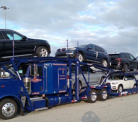 Shaw Auto Carriers - Melbourne, FL. the new 2021 Peterbilt hauling new 2021 BMW's