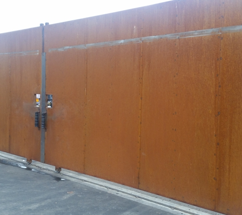 Building Block Masonry - Phoenix, AZ. 30 ft wide and 8 ft tall custom industrial metal gate