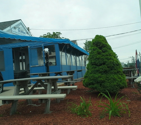 Skipper's Restaurant - Niantic, CT. View from parking spot on the side. Outdoor seating area.