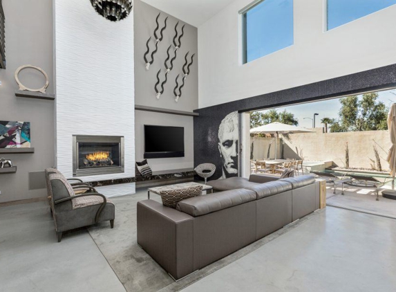 Integral Design Interiors - New Hope, PA. Contemporary grey leather seating group and fireplace in family room