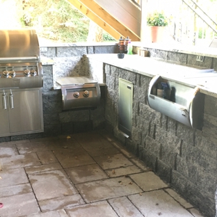 Dreamscapes Inc - Lincoln, NE. Complete outdoor kitchen with grill, power burner, and ice chest.