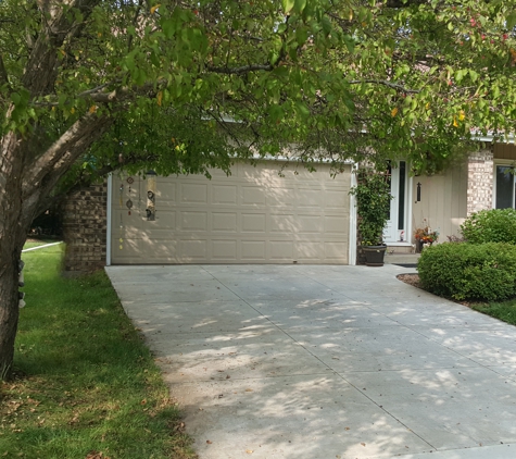 B & M Tree Service & Landscaping - Pierz, MN. Too close to garage and overhanging