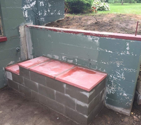 Anthony's Masonry and More - Lewiston, MI. Repaired leaning retaining wall and a block bench.