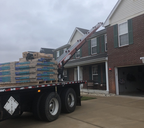 Barr Roofing & Exteriors. Off loading the supplies