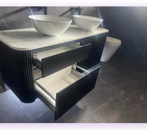 ROXTELL Kitchen Renovations Sydney - Chipping Norton, NSW. Supper black matt fluted vanity with Calcutta engineered stone