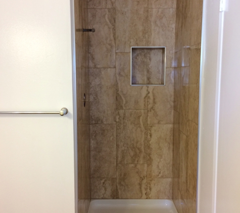 A Dan The Handyman - Santa Ana, CA. After bathroom remodel with new valve, new shower pan, new porcelain walls. Door to be installed soon.
