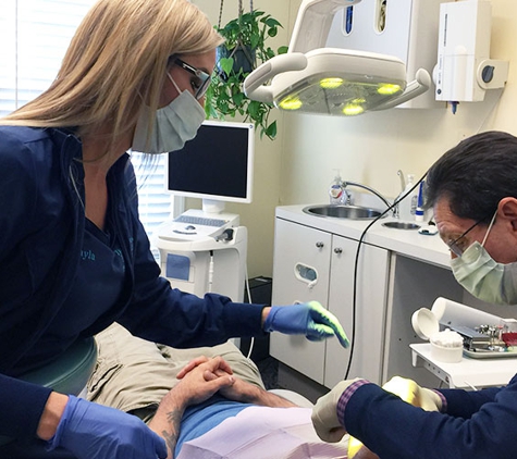 The Silberman Dental Group - Waldorf, MD. Waldorf dentist Dr. Paul B Silberman and his dental assistant working with a patient at The Silberman Dental Group