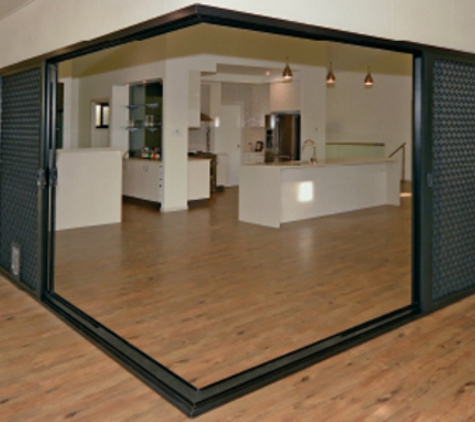 Bradnam's Windows & Doors - Urraween, QLD. Black Aluminium Corner Sliding Door