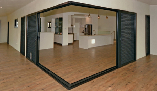 Bradnam's Windows & Doors - Bungalow, QLD. Black Aluminium Corner Sliding Door