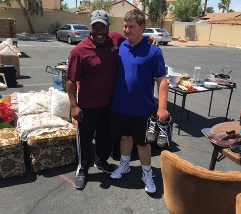 Greater Love International Fellowship - Las Vegas, NV. Pastor helping out at the yard sale.