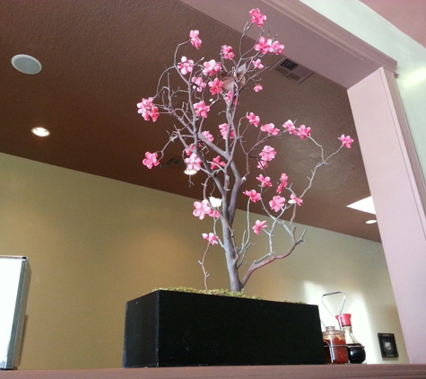 Pho Hut - Glendale, CA. Pink flower on divider wall