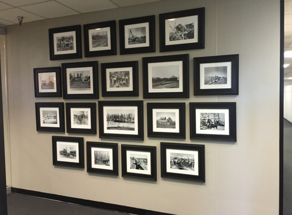 More Decor Design Inc - Tulsa, OK. Office picture hanging of company's historical pictures.