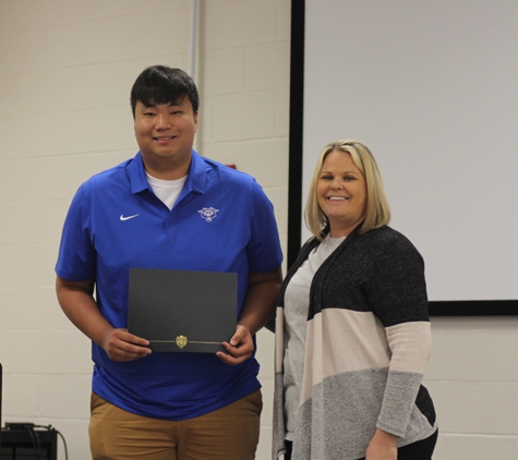 Audubon Federal Credit Union - Owensboro, KY. Mason P w-CEO Jessica Higdon awarding CM scholarship. 2023