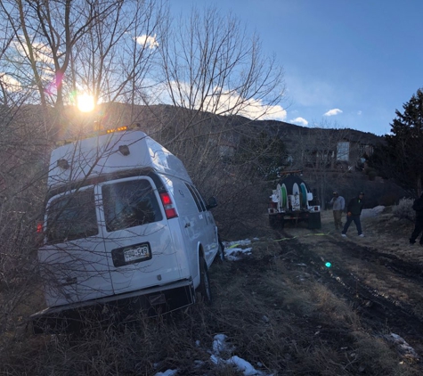 Father & Son  Towing - Littleton, CO. Van stuck in muddy clay we got it out