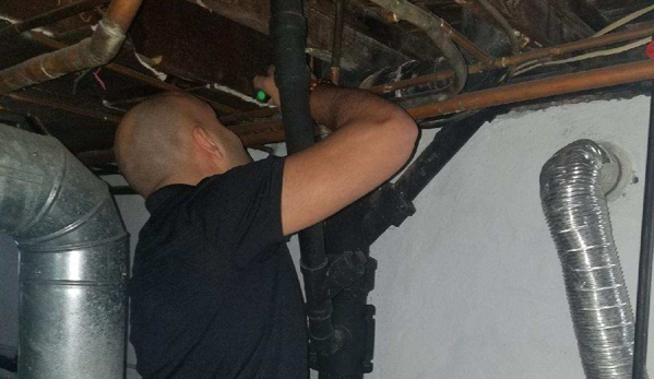 Outlet Home Inspections - Jersey City, NJ. Home Inspector checking the structural integrity of the house.