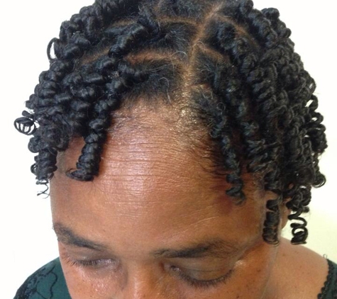 Genesis Hair Design - Smyrna, GA. Two strand twist and rod set :-) making for a long lasting hair style :-)