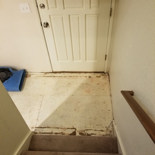 Roto-Rooter Plumbing & Water Cleanup - Lynnwood, WA. Torn up hardwood in entryway to dry