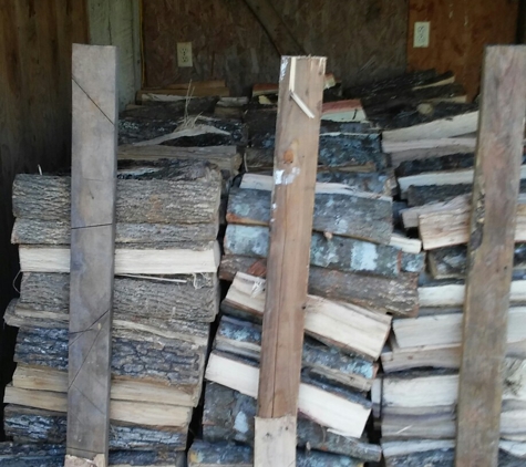 Hickmon's Wood Yard - Coldspring, TX. Kept under a building to dry it out faster.