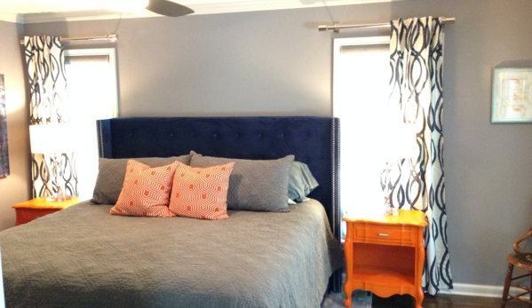 More Decor Design Inc - Tulsa, OK. clean contemporary bedroom design with a flare of orange accents